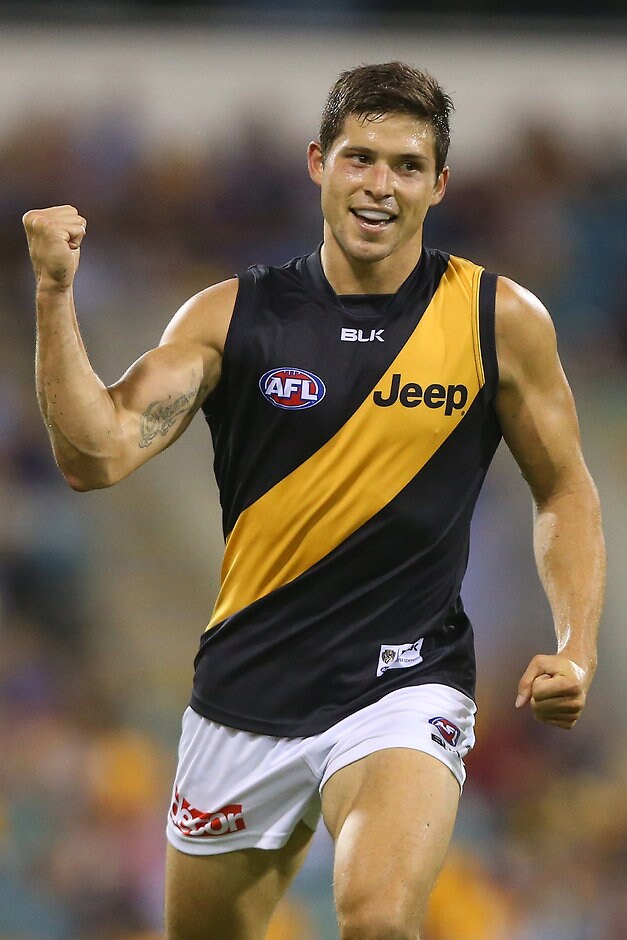 AFL 2015 Rd 03 - Brisbane v Richmond BRISBANE, AUSTRALIA - APRIL 18: Chris Knights of the Tigers celebrates a goal during the round three AFL match between the Brisbane Lions and the Richmond Tigers at The Gabba on April 18, 2015 in Brisbane, Australia. (Photo by Chris Hyde/Getty Images)